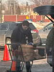 Zinner and Co. Employee Loading Items Into A Vehicle At The Greater Cleveland Foodbank